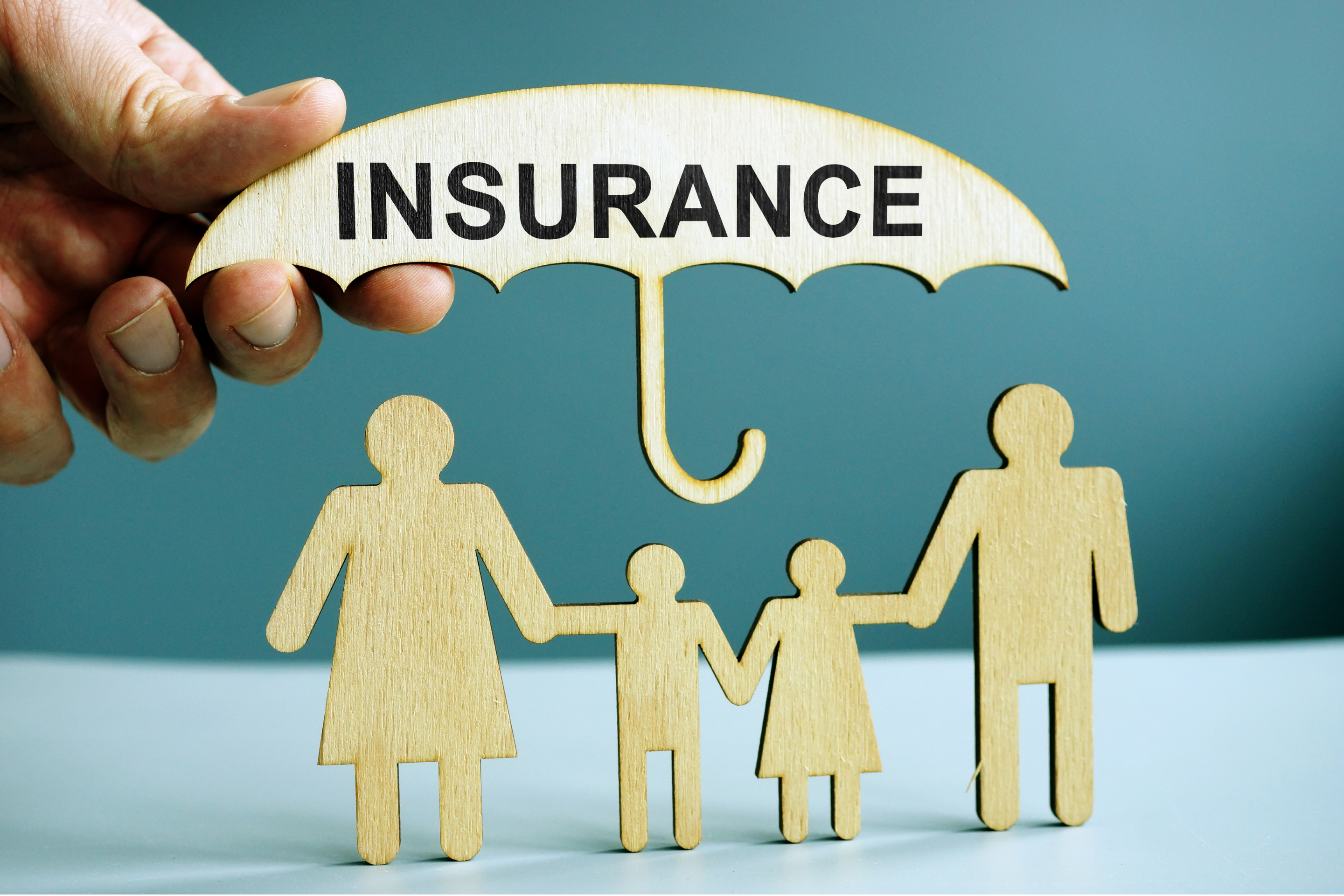 Life insurance needs met | image of insureance as an umbrella covering a family